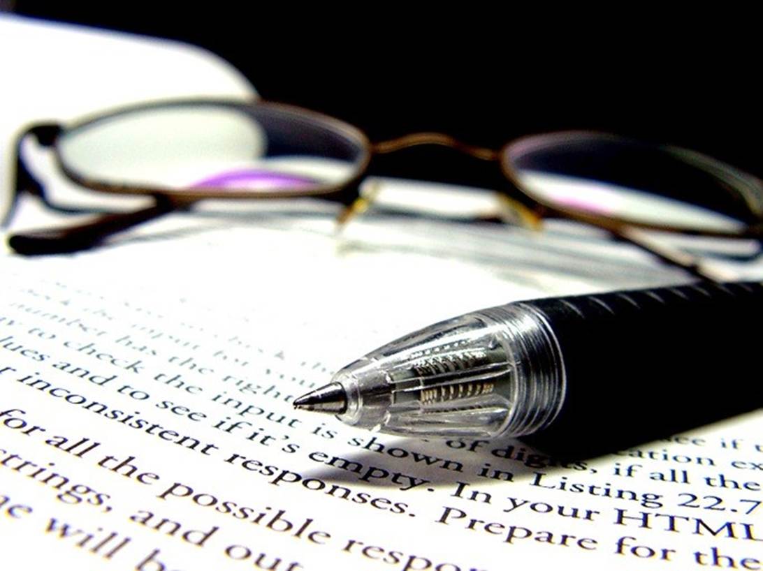 A pen and glasses on a piece of paper

AI-generated content may be incorrect.